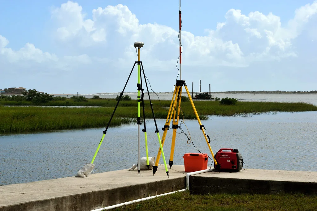 Modern surveying equipment measuring a plot of land